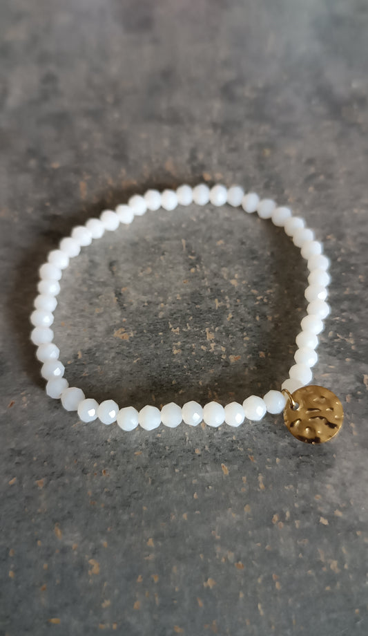 Bracelet ajustable par son élasticitée petit médaillon en acier inoxydable
